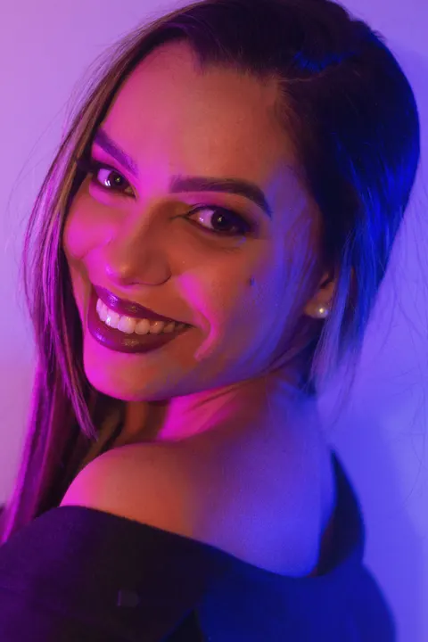 Close-up portrait of a VividPress client, all smiles after their brand launch